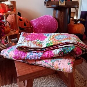 Vibrant Floral Quilt with Pink and Green Accents